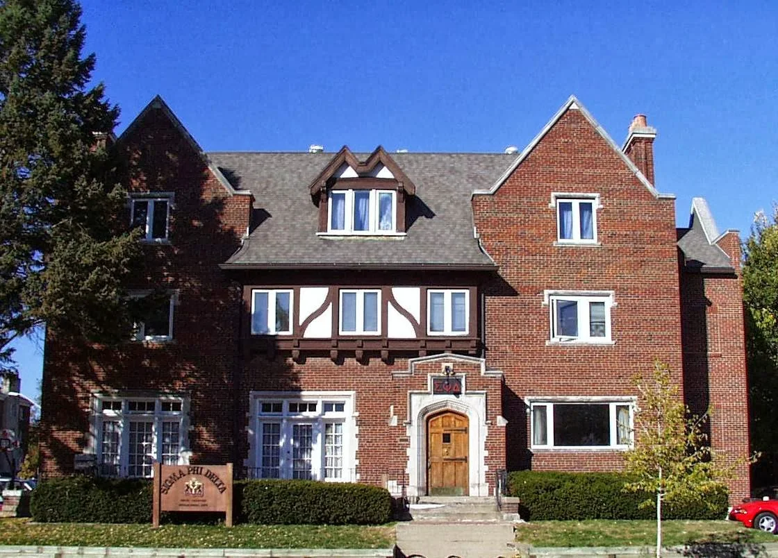 Sigma Phi Delta brothers gathered at the UIUC campus courtyard